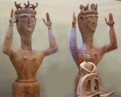 Several large clay goddesses with arms raised up