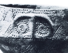 clay vessel with round eyes and brow