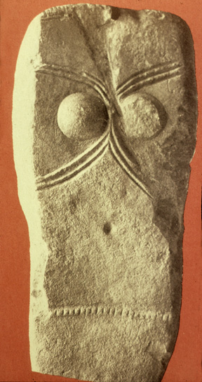 headless breasted stela with curved lines and belt